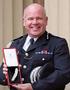 Sir Craig Mackey and bravery award.jpg